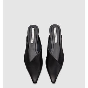 Black Goat skin mule in Asymmetric shaped heel